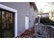 Home's exterior with gray brick, deck, and stairs at 2072 Clairmont Ter, Atlanta, GA 30345