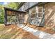 Walkway to screened porch and house exterior with brick and siding at 1972 Peeler Rd, Atlanta, GA 30338