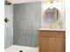 Modern basement bathroom with light wood vanity and blue tile shower at 1972 Peeler Rd, Atlanta, GA 30338