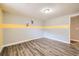 Cozy bedroom with gray and yellow walls, and hardwood floors at 3046 Briarcliff Ne Rd # 15, Atlanta, GA 30329