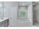 Bathroom with soaking tub, shower, and double vanity at 110 Dunning Keep, Covington, GA 30016