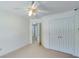 Bright bedroom with ceiling fan and double doors leading to a spacious closet at 110 Dunning Keep, Covington, GA 30016