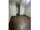 Primary bedroom with neutral walls and vinyl flooring at 2700 Pine Tree Ne Rd # 1005, Atlanta, GA 30324