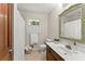 Clean bathroom with updated vanity and mirror at 5775 Lakeshore Dr, Buford, GA 30518