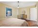 Bright bedroom with queen-size bed, hardwood floors, and natural light at 822 Gertrude Nw Pl, Atlanta, GA 30318