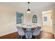 Charming dining room with round table, four chairs, and hardwood floors at 822 Gertrude Nw Pl, Atlanta, GA 30318
