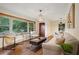 Open living room with hardwood floors, comfortable seating, and natural light at 822 Gertrude Nw Pl, Atlanta, GA 30318