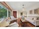 Spacious living room with hardwood floors, ample natural light and comfy seating at 822 Gertrude Nw Pl, Atlanta, GA 30318