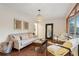 Living room with hardwood floors, comfy seating, and large window at 822 Gertrude Nw Pl, Atlanta, GA 30318