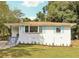 Ranch home with light brick exterior and blue shutters at 822 Gertrude Nw Pl, Atlanta, GA 30318