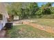 Backyard with concrete patio and terraced landscaping at 822 Gertrude Nw Pl, Atlanta, GA 30318
