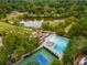 Aerial view of community pool, tennis courts, and clubhouse at 46 Monet Nw Ct, Atlanta, GA 30327