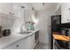 Modern kitchen with white cabinets, stainless steel appliances, and subway tile backsplash at 46 Monet Nw Ct, Atlanta, GA 30327
