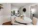 Bright dining area with round table and seating for four, showcasing an open floor plan at 46 Monet Nw Ct, Atlanta, GA 30327