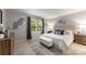 Spacious main bedroom with a plush bed, neutral decor, and ample natural light at 46 Monet Nw Ct, Atlanta, GA 30327