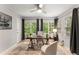 Sunlit home office featuring a workspace with a wooden desk and ample natural light at 46 Monet Nw Ct, Atlanta, GA 30327