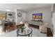 Open living room and dining area featuring hardwood floors and modern furniture at 46 Monet Nw Ct, Atlanta, GA 30327