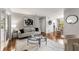 Bright living room with hardwood floors, neutral decor, and a view into the dining area at 46 Monet Nw Ct, Atlanta, GA 30327