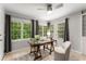 Bright home office with a desk, chair, and large windows offering natural light at 46 Monet Nw Ct, Atlanta, GA 30327