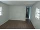 Bright living room with wood flooring and beadboard walls at 64 Luther Knight Se Rd, Cartersville, GA 30121