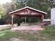Rustic carport providing covered parking and storage at 64 Luther Knight Se Rd, Cartersville, GA 30121