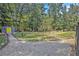 Landscaped yard with gravel pathway and shed at 103 Royal Way, Mcdonough, GA 30252