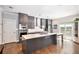 Modern kitchen with gray cabinets, quartz countertops, and island at 103 Royal Way, Mcdonough, GA 30252