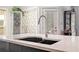 Kitchen island with a large double sink and modern faucet at 103 Royal Way, Mcdonough, GA 30252