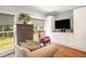 Relaxing sitting area with built-in cabinetry and hardwood floors at 103 Royal Way, Mcdonough, GA 30252