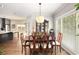 Open concept dining area with hardwood floors and kitchen view at 103 Royal Way, Mcdonough, GA 30252