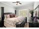 Spacious primary bedroom with a king-size bed and plenty of natural light at 103 Royal Way, Mcdonough, GA 30252