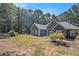 Gray house exterior, showcasing landscaping and a driveway at 103 Royal Way, Mcdonough, GA 30252