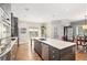 Modern kitchen with gray cabinets, quartz countertops and island at 103 Royal Way, Mcdonough, GA 30252