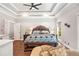 Main bedroom with hardwood floors and a king-size bed at 103 Royal Way, Mcdonough, GA 30252