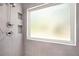 Clean shower with updated fixtures and a frosted window for privacy at 103 Royal Way, Mcdonough, GA 30252