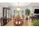 Bright dining room with hardwood floors and a large table at 103 Royal Way, Mcdonough, GA 30252