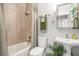 Clean and updated bathroom with a tub, shower, and pedestal sink at 103 Royal Way, Mcdonough, GA 30252