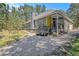 Gray house with yellow door, a deck, and a gravel driveway at 103 Royal Way, Mcdonough, GA 30252