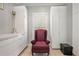 Bright office space with built-in shelving and a comfortable armchair at 103 Royal Way, Mcdonough, GA 30252