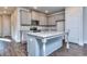 Open concept kitchen featuring an island and hardwood floors at 6186 Ripple Way # 84, South Fulton, GA 30349