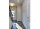 Sunlit foyer with wood-look floors and staircase at 6186 Ripple Way # 84, South Fulton, GA 30349