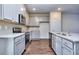 Modern kitchen with stainless steel appliances and an island at 6186 Ripple Way # 84, South Fulton, GA 30349