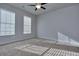 Well-lit bedroom with carpet and window blinds at 6186 Ripple Way # 84, South Fulton, GA 30349