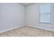 Small bedroom with carpet and window at 6186 Ripple Way # 84, South Fulton, GA 30349
