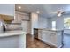 Modern kitchen with stainless steel appliances and gray cabinets at 6186 Ripple Way # 84, South Fulton, GA 30349