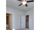 Spacious bedroom with ceiling fan and access to bathroom at 6186 Ripple Way # 84, South Fulton, GA 30349
