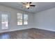 Spacious living room with hardwood floors and large windows at 6186 Ripple Way # 84, South Fulton, GA 30349