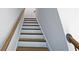 Indoor staircase with wooden steps and handrail at 1101 Parktown Dr # 11, Mableton, GA 30126