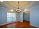 Dining room with hardwood floors, chandelier, and window seat at 6865 Cowan Mill Rd, Winston, GA 30187
