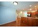 Open concept kitchen with breakfast bar and hardwood floors at 6865 Cowan Mill Rd, Winston, GA 30187